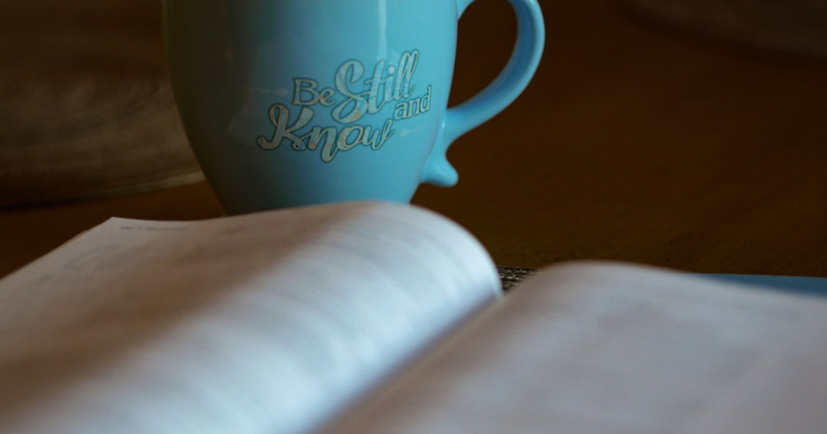 coffee mug with bible Be Still and Know